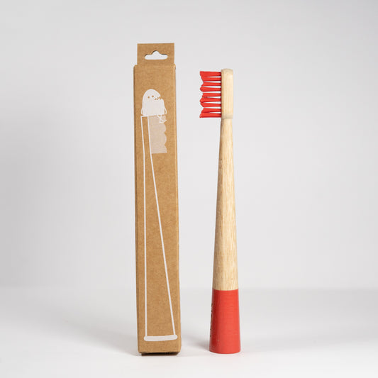 Kids Bamboo Toothbrushes with a red handle enclosed in a recyclable cardboard box. (Brand: FLON)