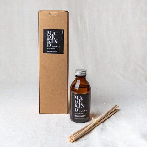 MadeKind Awaken aromatherapy reed diffuser in glass amber bottle. Pure essential oil blend includes Lemon, Eucalyptus and peppermint. Reeds come included and presented in a Kraft gift box.