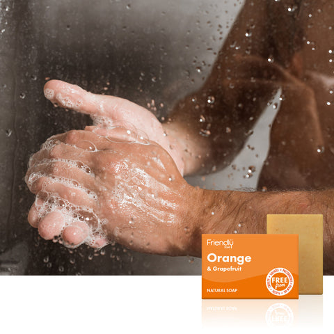 Man in shower using Friendly Soap - Orange & Grapefruit Natural Soap Bar