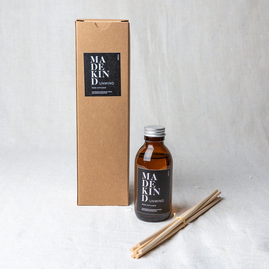 MadeKind Awaken aromatherapy reed diffuser in glass amber bottle. Pure essential oil blend includes Rose, Jasmine and Ylang Ylang. Reeds come included and presented in a Kraft gift box.  Edit alt text