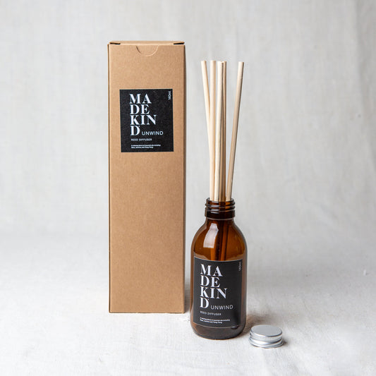 MadeKind Awaken aromatherapy reed diffuser in glass amber bottle. Pure essential oil blend includes Rose, Jasmine and Ylang Ylang. Reeds come included and presented in a Kraft gift box.