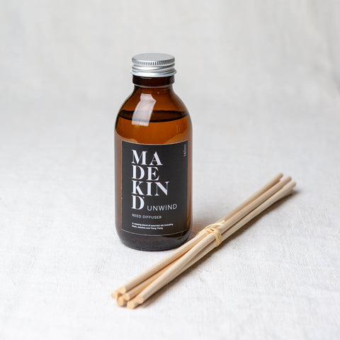 MadeKind Awaken aromatherapy reed diffuser in glass amber bottle. Pure essential oil blend includes Rose, Jasmine and Ylang Ylang. Reeds come included and presented in a Kraft gift box.  