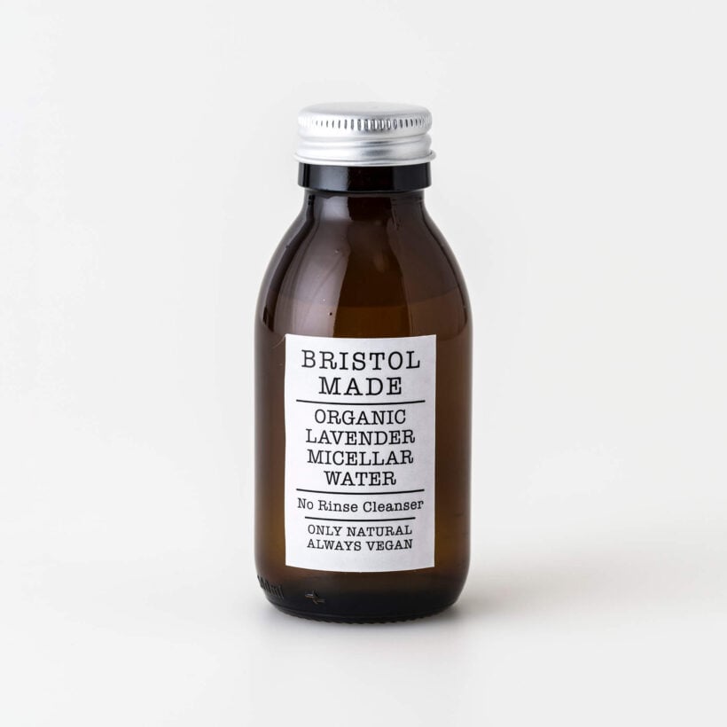 Bristolmade lavender micellar water in a 100ml amber glass bottle, with a white label and black text, highlighting the natural ingredients of the cleanser.