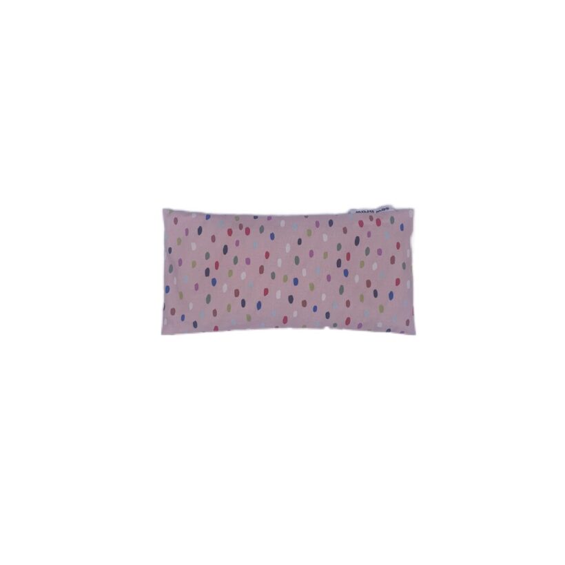 Photo of a pale pink cotton covered eye pillow with various coloured spots on.