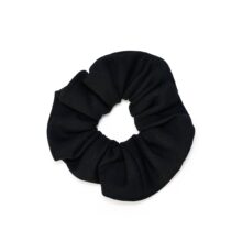 Eco-conscious black scrunchie made from biodegradable, Cradle to Cradle Certified® fabric by Wellicious – sustainable zero-waste hair accessory