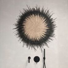 Ethically sourced natural sun disc with black edging for stunning statement wall decor