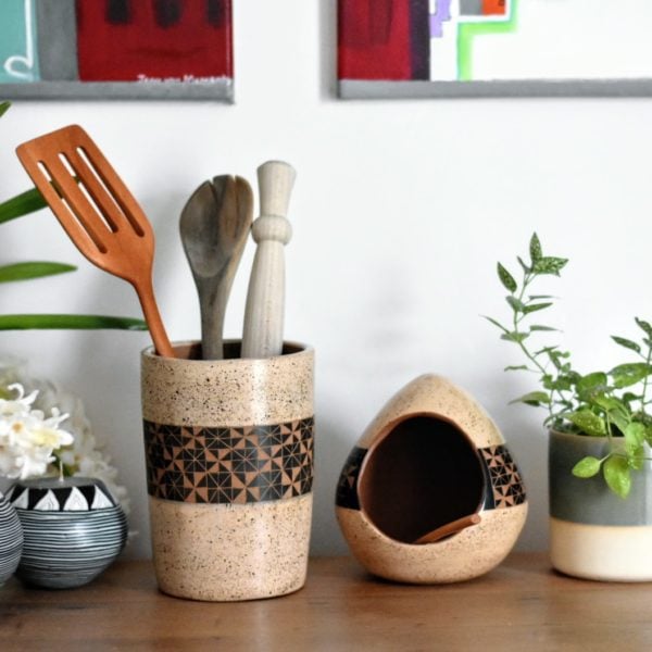 matching-ceramic-cream-salt-cellar-and-utensil-holder-on-kitchen-countertop.jpg