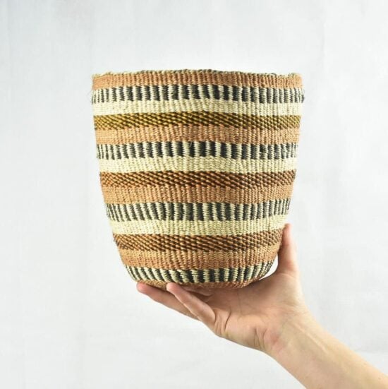 Traditionally patterned medium fine weave sisal basket with the name of the maker on the side