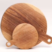 round olive wood chopping boards in 2 sizes with short handle
