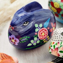 Dark blue hand painted papier mache rabbit trinket box with delicate painted floral motif
