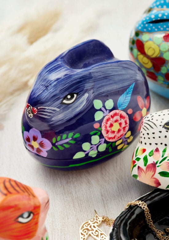 Dark blue hand painted papier mache rabbit trinket box with delicate painted floral motif